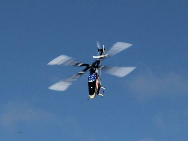 - A thing of beauty in flight, the Quattro rotor head has a special look!