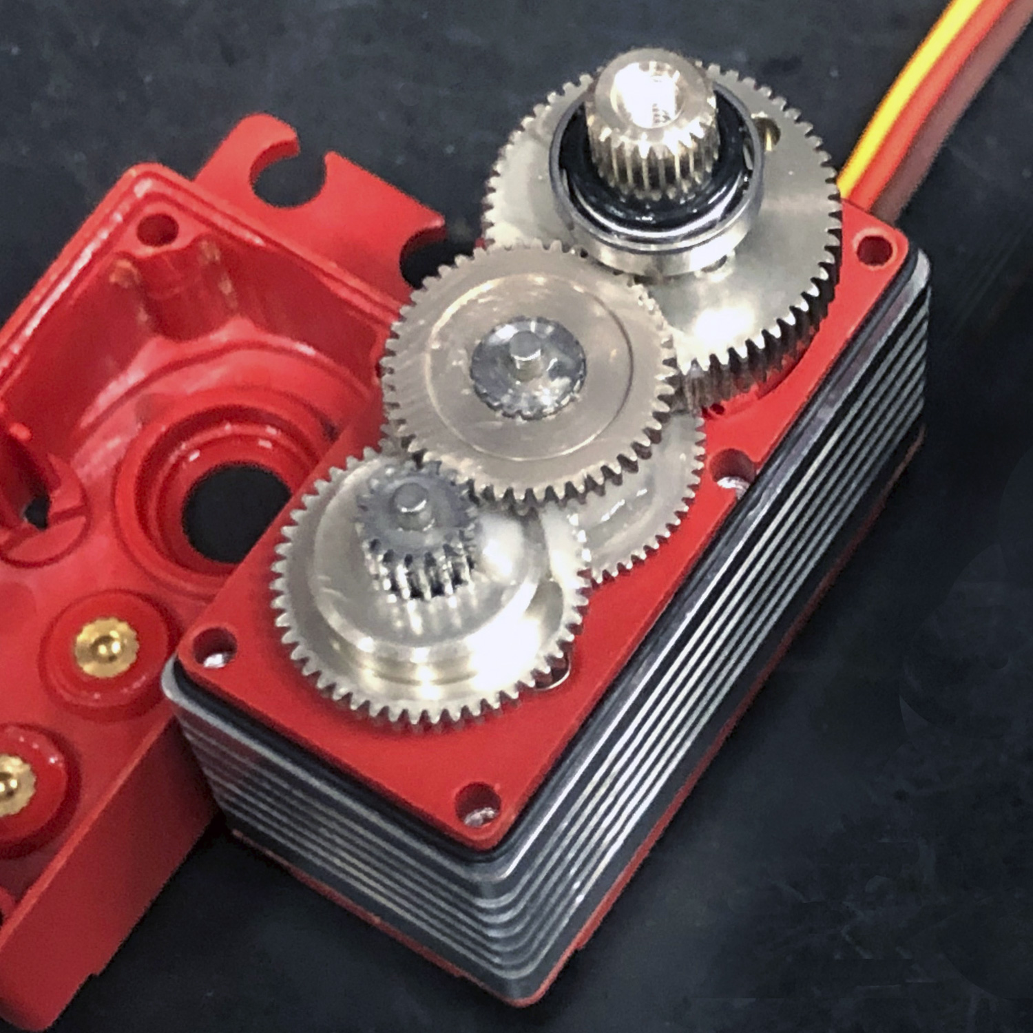 Close up of the stainless steel gear train of a ProModeler DS415BLHV servo