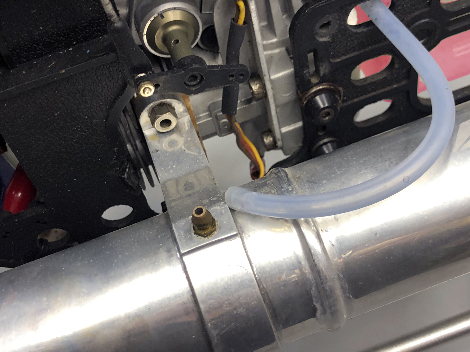 Close up of fuel line unattached to the uffler's pressure fitting