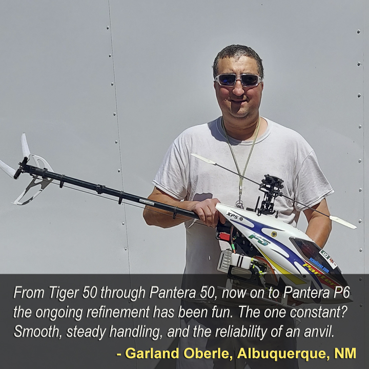 Close up of Audacity Models customer Garland Oberle of Albuquerque, NM holding a Pantera P6 whilst wearing a self-satisfied smile for the joy of owning the airframe